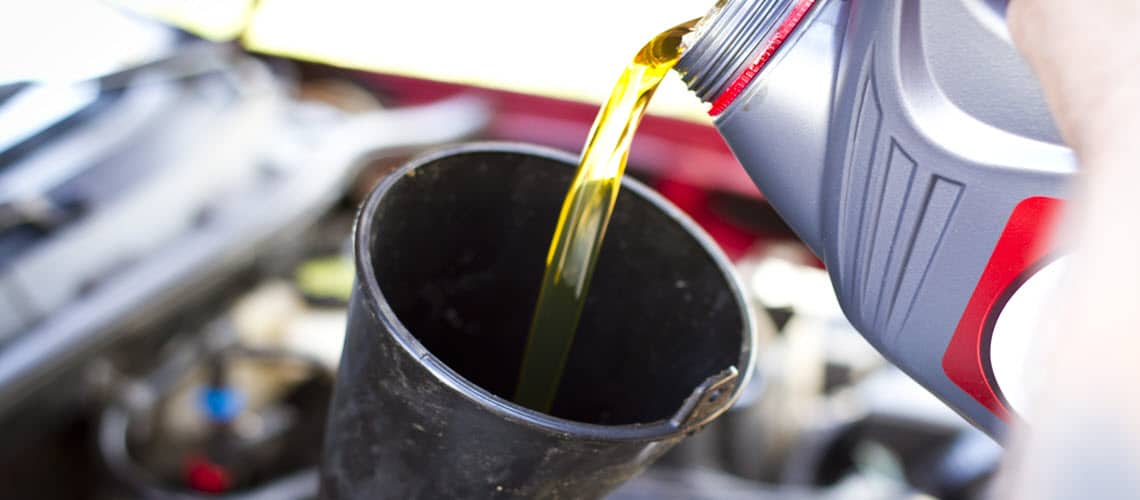 Adding New Oil to Car