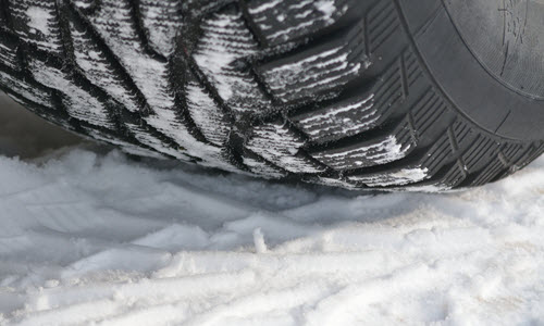 Car Tire Over Snow